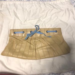 Tan and blue leather clutch